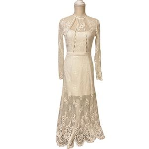 Alexis long sleeve lace evening gown. Fully lined.  Laced hem detail. Open back